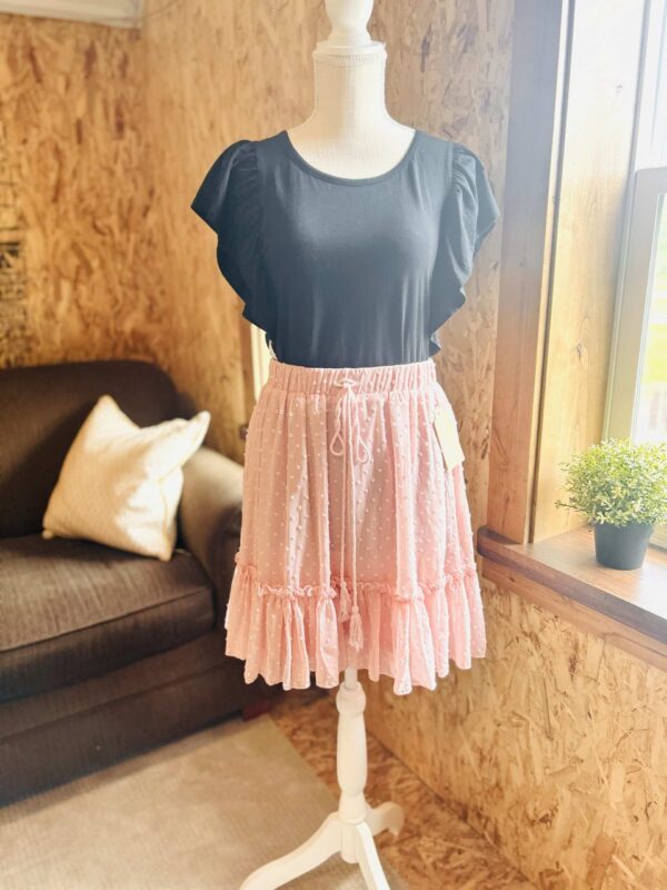 Black shirt/pink skirt