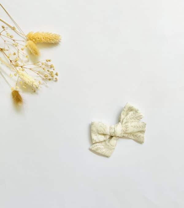 Cream/ tan floral pinwheel bow