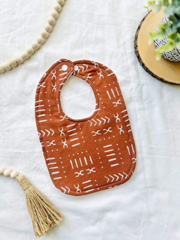 Burnt Orange/Aztec print bib
